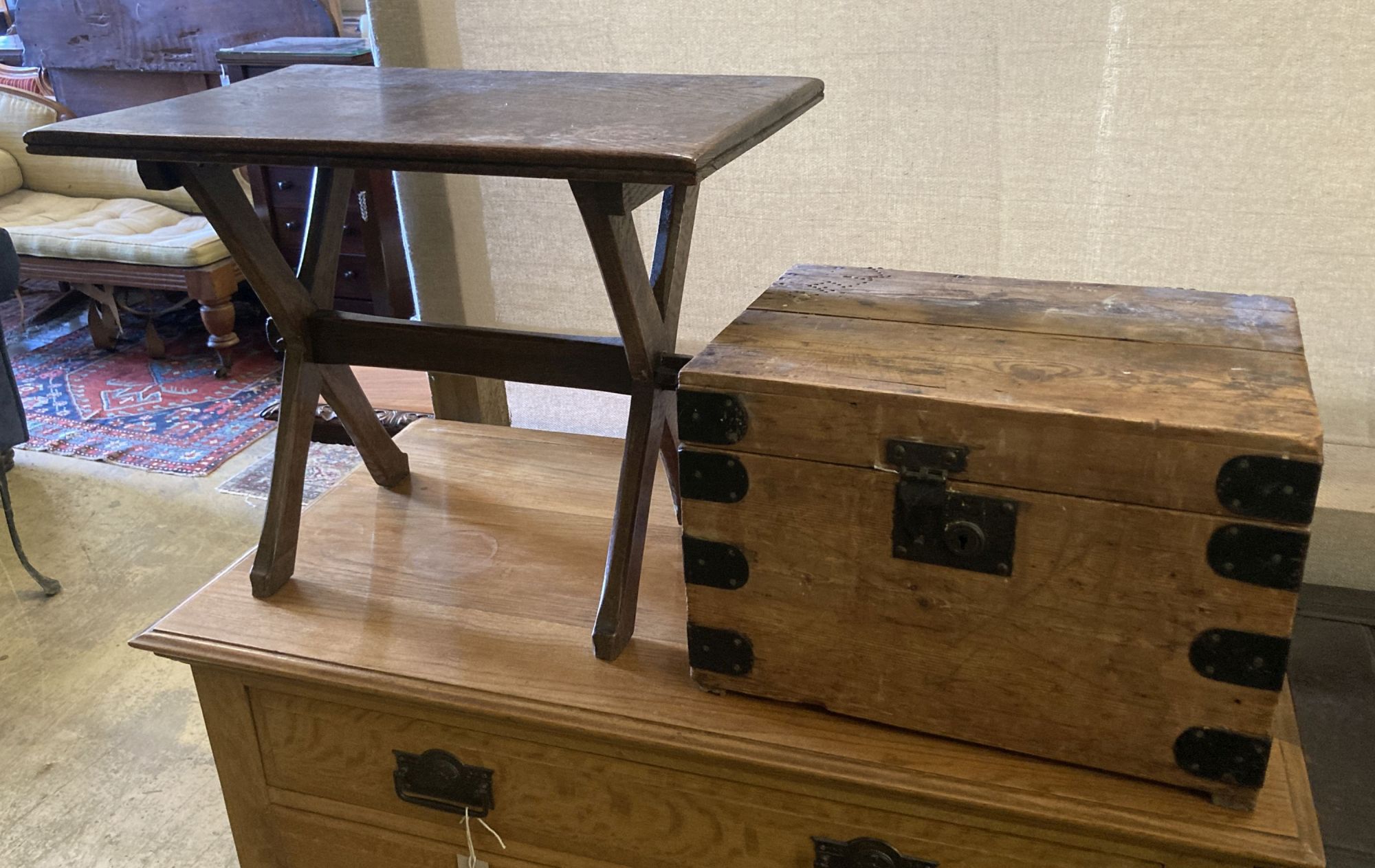 A rectangular oak X frame occasional table, width 61cm, depth 39cm, height 49cm together with a small Victorian iron bound pine trunk,